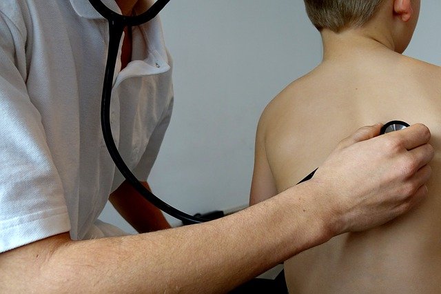 doctor examining a child