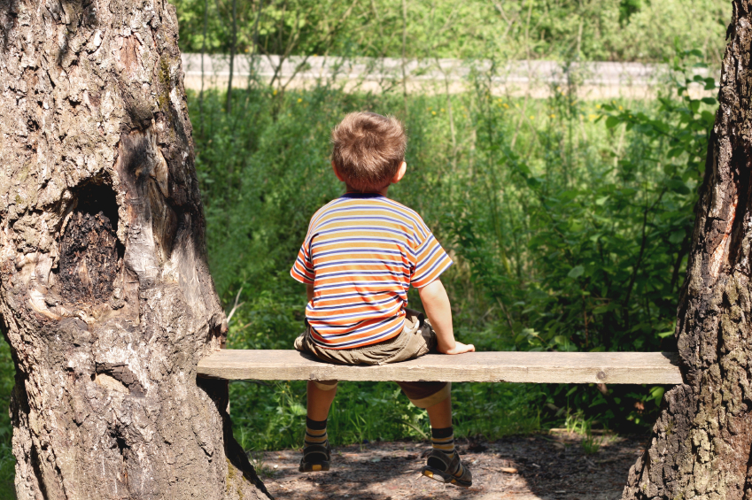 Sun protection boy on bench